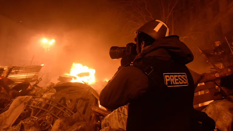 Journalist documenting events at the Independence square. Clashes in Ukraine, Kyiv. Events of February 18, 2014.